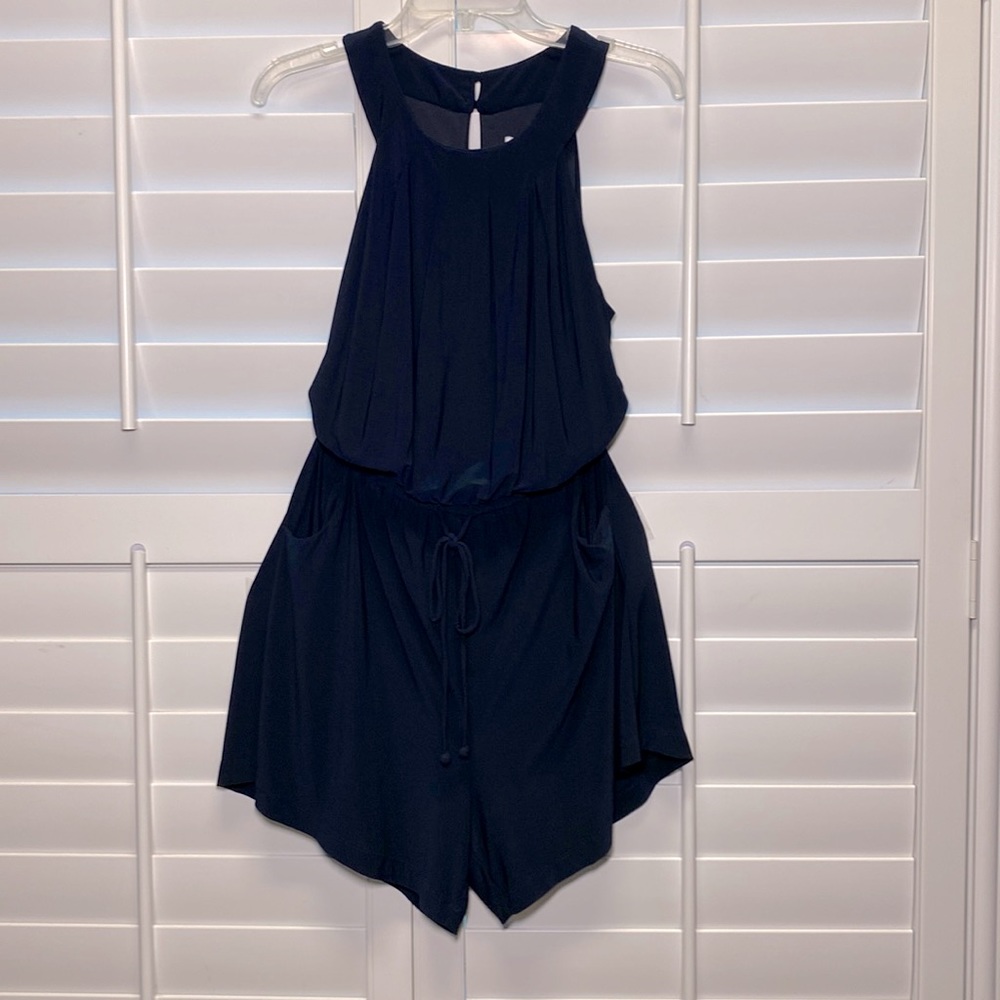 Navy scoop-neck sleeveless romper shorts with pockets